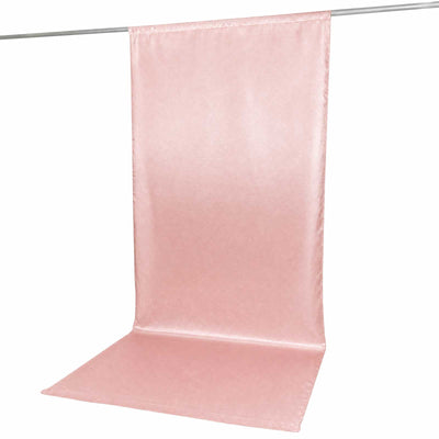 Pink satin backdrop with floor panel hanging on a crossbar stand
