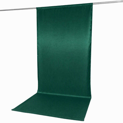 Green backdrop curtain for photography with floor sweep on hanging rod