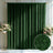 Green textured backdrop with floral arrangements in a stylish interior setting.