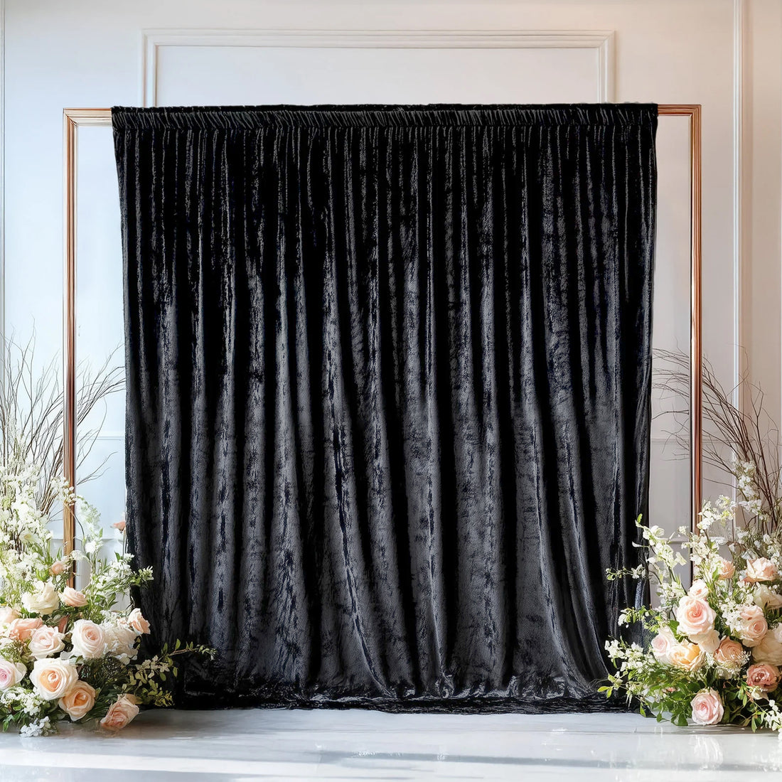 Black velvet backdrop with floral arrangements