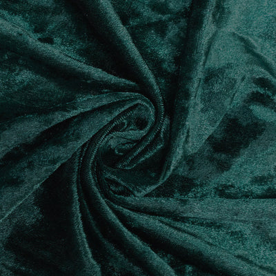 Deep green plush fabric texture in a swirling pattern. #whtbkgd