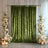 Green velvet wedding backdrop with floral arrangements and candles