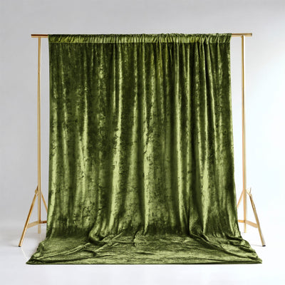 Olive green velvet curtain backdrop on gold stand with draped floor fabric