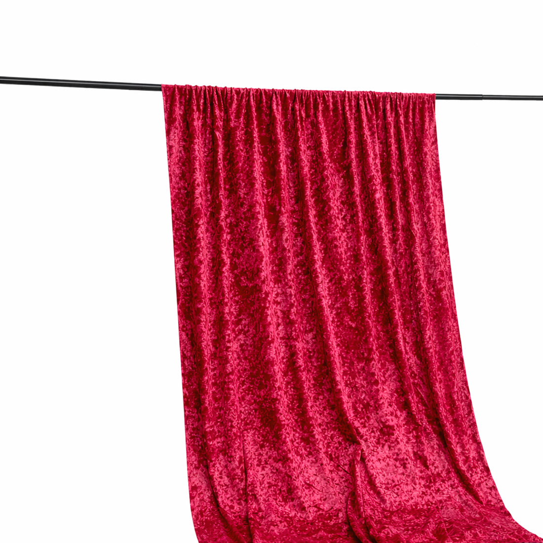 Red velvet fabric draped on a rod, showcasing its rich texture and color.
