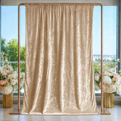 Elegant champagne gold backdrop curtain with floral arrangements and copper stand