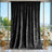 Black velvet curtain backdrop with gold frame and floral arrangements