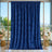Blue velvet backdrop curtain on copper frame with floral arrangements