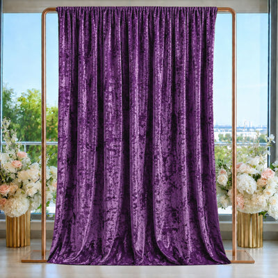 Purple velvet backdrop curtain with gold frame and floral arrangements