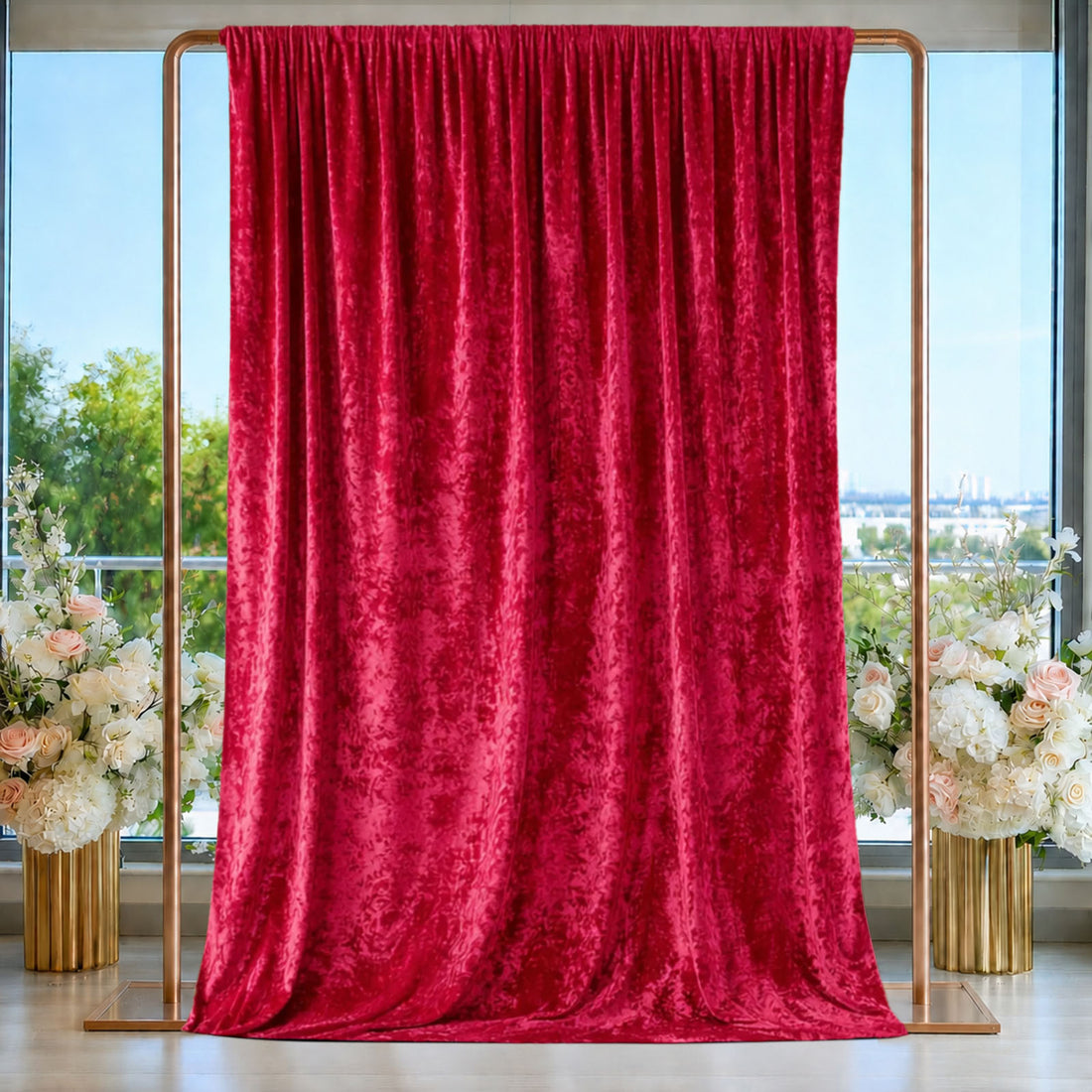 Red velvet curtain backdrop with gold frame and floral wedding decor