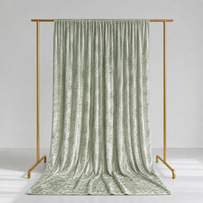 Sage green velvet curtain panel on gold clothing rack, product display
