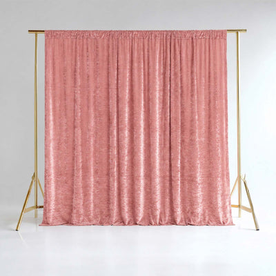 Pink velvet curtain backdrop with gold metal stand on white background