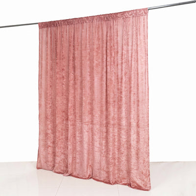 Pink sheer curtain hanging on a rod against a white background