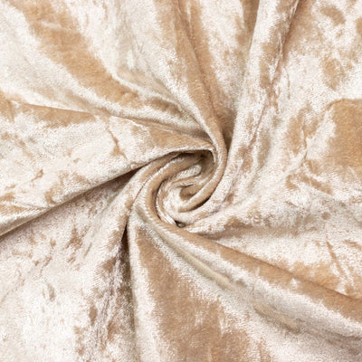 Beige velvet fabric texture with elegant spiral folds and soft sheen#whtbkgd