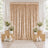 Elegant gold wedding backdrop with white floral arrangements and candles