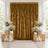 Elegant gold velvet curtain backdrop with white floral arrangements and candles