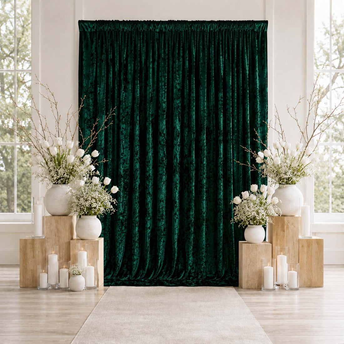 Emerald velvet backdrop with white floral wedding decor and candles