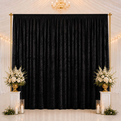 Elegant black wedding backdrop with gold frame and white floral arrangements