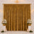 Gold wedding backdrop curtain with floral arrangements and candles