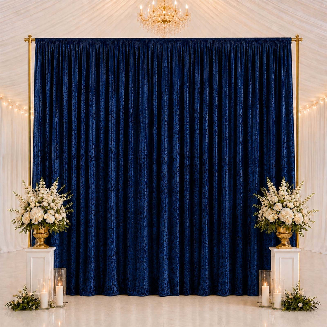 Elegant navy blue curtain backdrop with floral arrangements and gold accents
