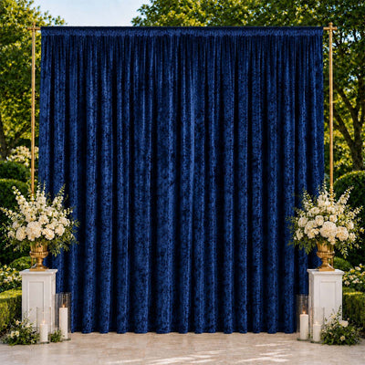 Elegant navy blue wedding backdrop with white floral arrangements outdoors