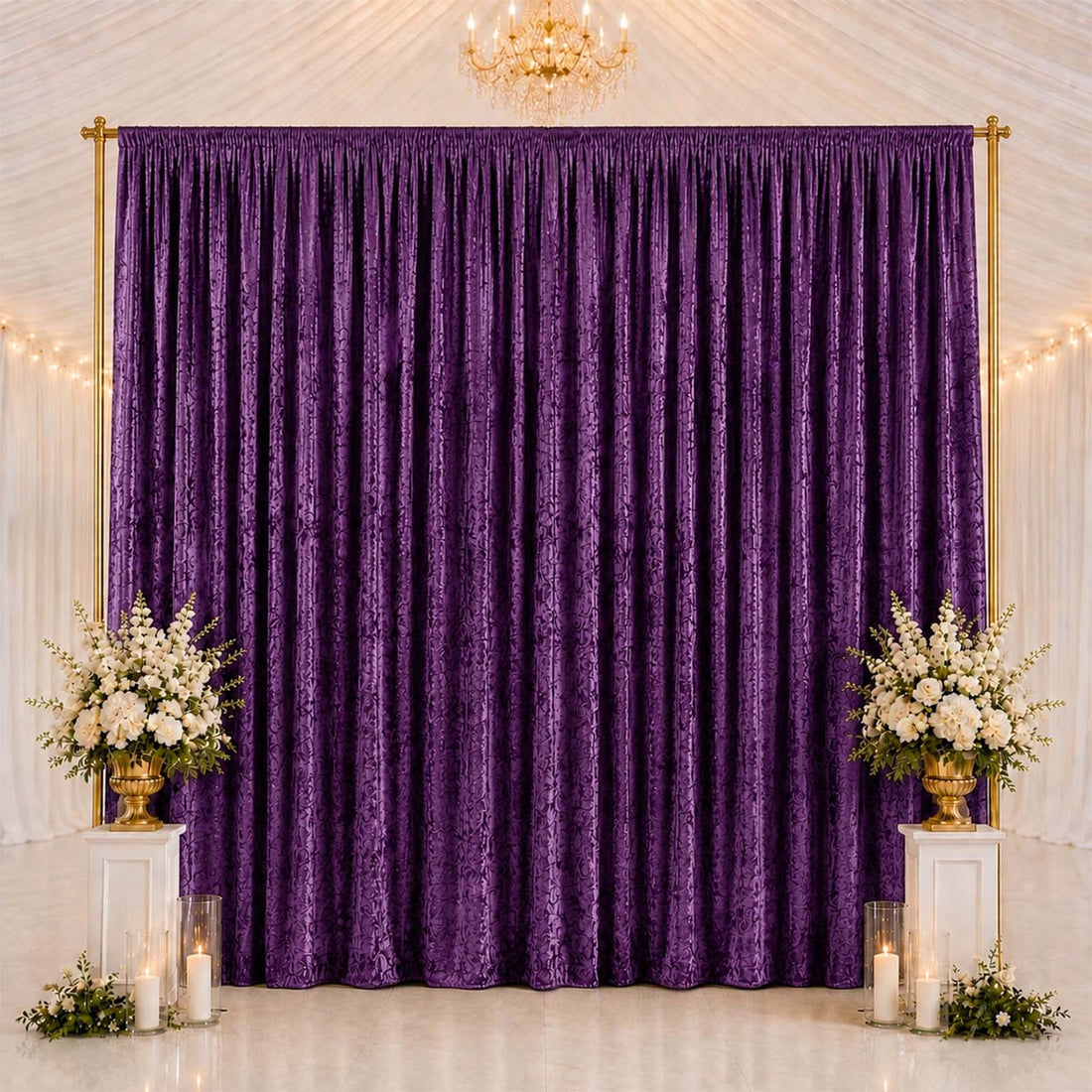 Elegant purple backdrop curtain with floral arrangements and candles