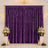 Elegant purple backdrop curtain with floral arrangements and candles