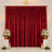Elegant red velvet backdrop with gold frame, white floral arrangements, and candles