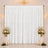 Elegant wedding backdrop with white drapes, gold frame, and floral arrangements