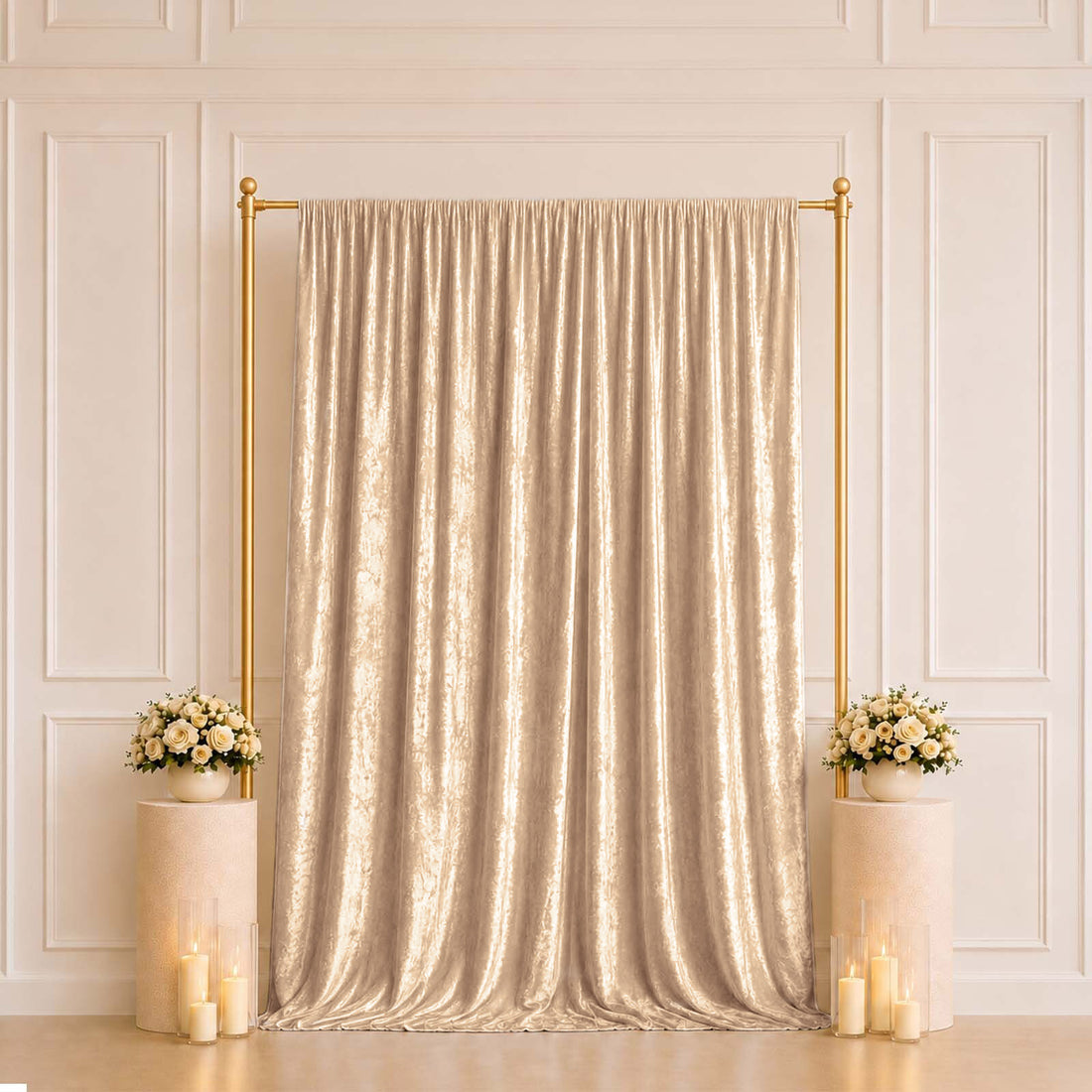 Gold shimmer curtain backdrop with floral pedestals and candles