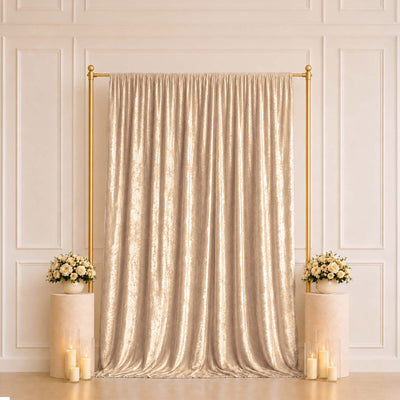 Gold shimmer curtain backdrop with floral pedestals and candles