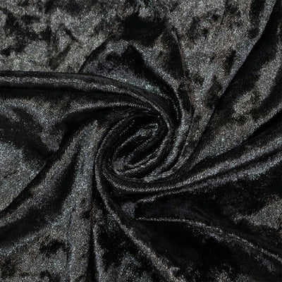 Black velvet fabric texture with swirling folds and glossy sheen#whtbkgd