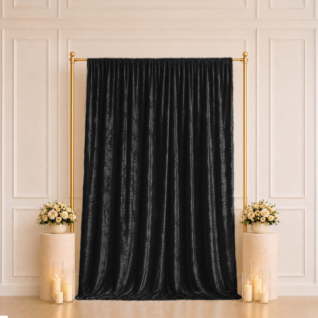 Black velvet curtain backdrop with gold frame and floral pedestal decor