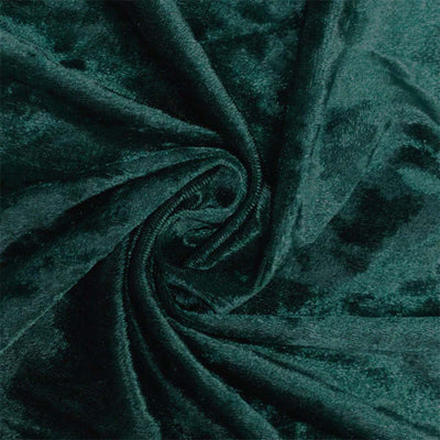 Dark green velvet fabric texture with soft folds and swirls#whtbkgd