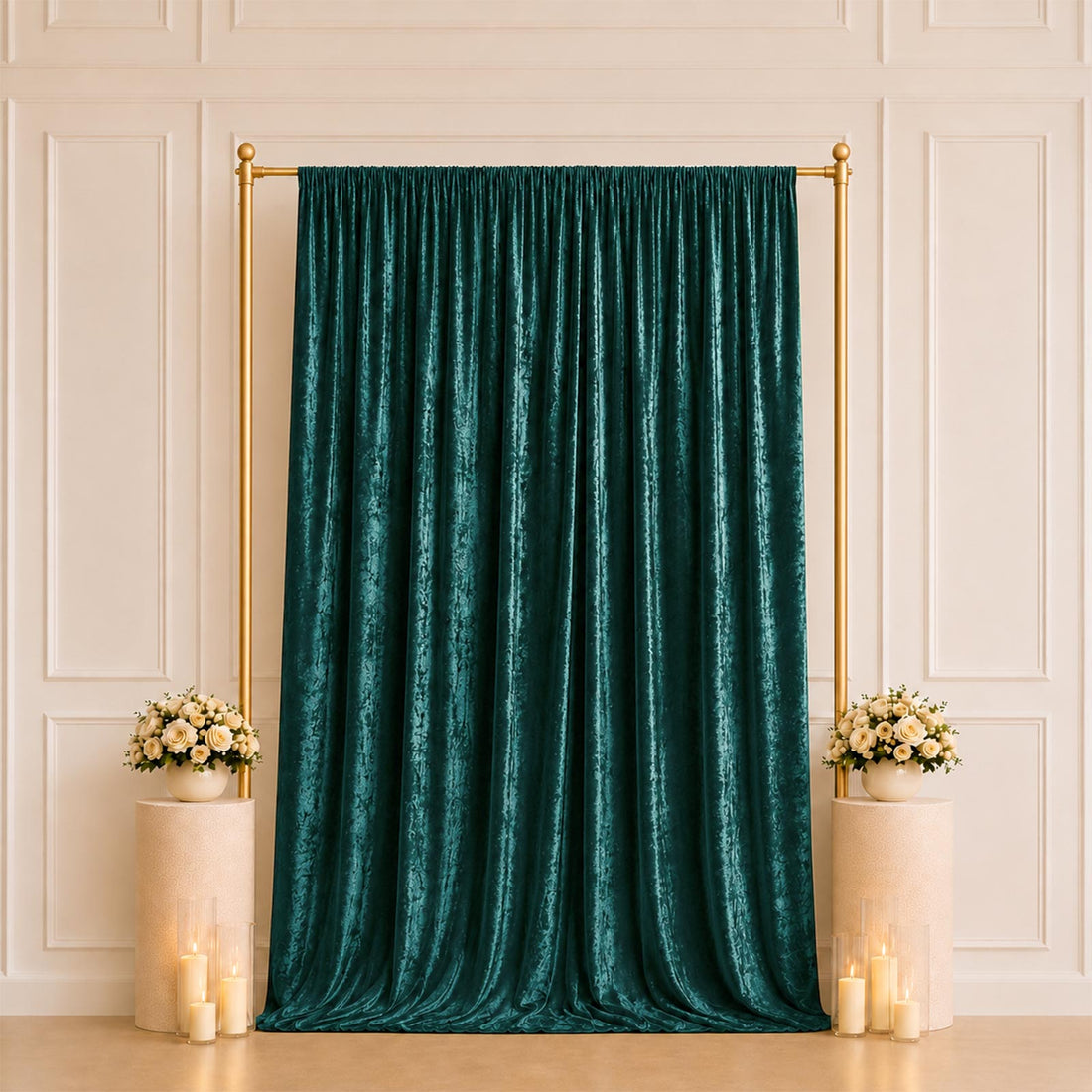 Emerald velvet curtain backdrop with gold frame and floral arrangements
