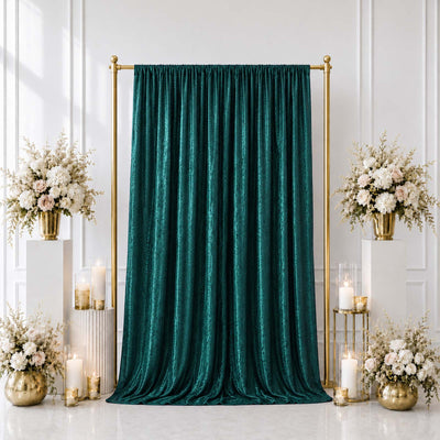 Emerald green velvet backdrop with gold frame and floral wedding decor