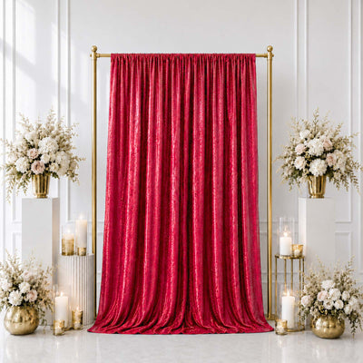 Elegant red velvet curtain with gold stand and floral wedding decor background