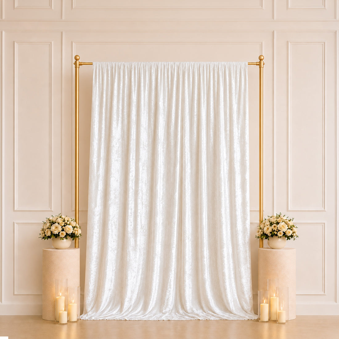 Elegant wedding backdrop with white drape, gold frame, roses, and candles