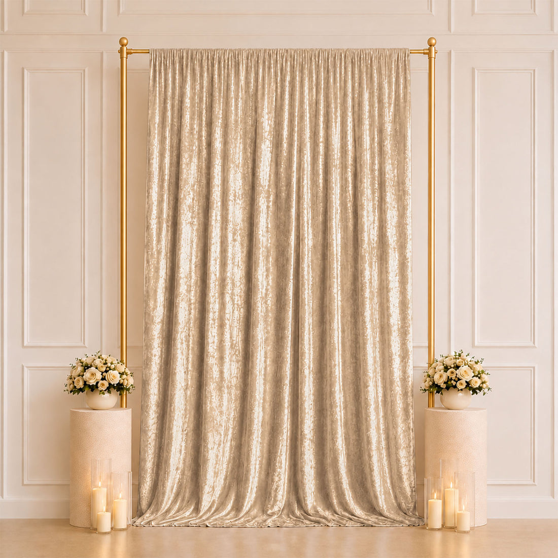 Elegant gold draped wedding backdrop with floral arrangements and candles