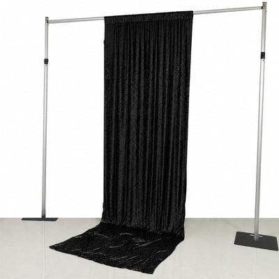 Black draped photo booth backdrop on adjustable pipe frame stand