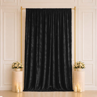 Black velvet backdrop curtain with gold frame and floral pedestal decor