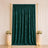 Emerald green velvet curtain backdrop with gold stand and floral decor
