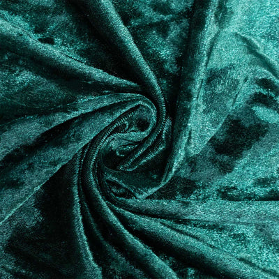 Emerald green velvet fabric texture with swirling folds#whtbkgd