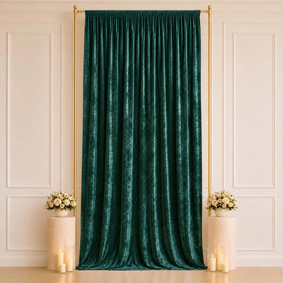 Emerald green velvet curtain with gold frame and floral candle décor