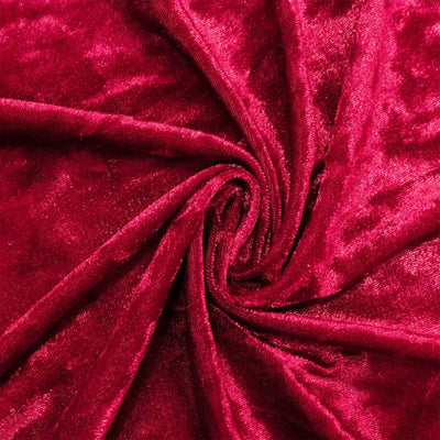 Close-up of vibrant red velvet fabric with twisted swirl folds#whtbkgd
