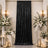 Elegant black velvet curtain with white floral wedding ceremony decor and candles