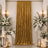 Elegant gold velvet curtain with white floral wedding decor and candles