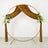 Gold wedding circle arch with velvet drape and floral arrangements