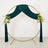 Teal velvet wedding backdrop with gold circular frame and floral arrangements