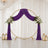 Purple wedding arch with white floral arrangements and lanterns on elegant drapes