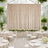 Elegant greenhouse wedding reception with cream drapery and floral tablescape